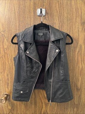 Sinful Black Faux Leather Star-Embossed Sleeveless Vest with Shearling Lining